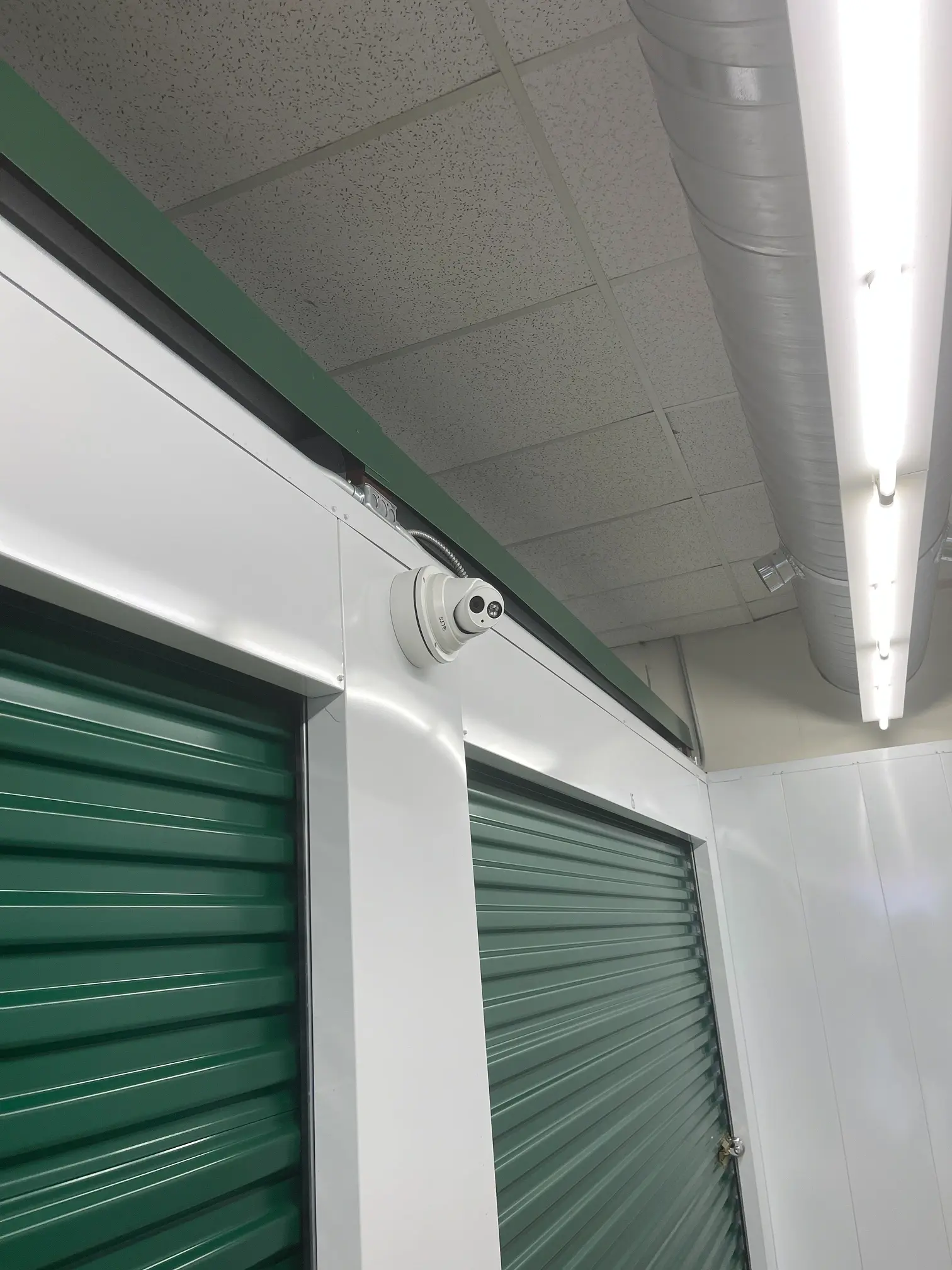 Climate controlled interior hallway with green doors
